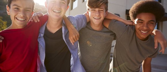 Portrait Of Male High School Student Friends Outside College Buildings