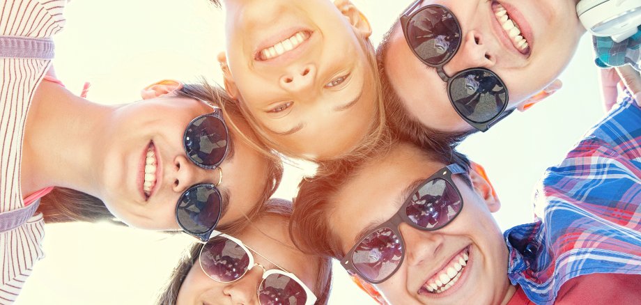 funny portrait of group of teenagers spending time together