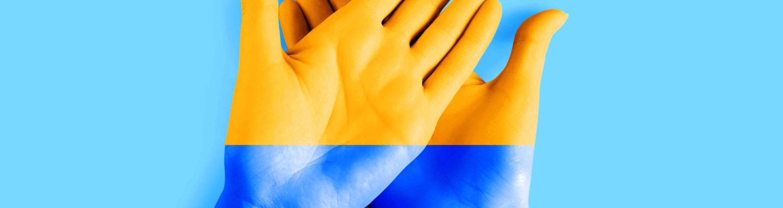 Female hands painted in the colors of the flag of Ukraine. Ukraine Independence Day background, freedom, friendship, unity concept.
