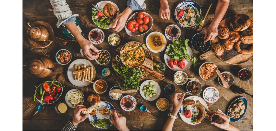 Flat-lay of Turkish family having traditional breakfast with various food