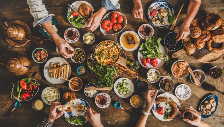 Flat-lay of Turkish family having traditional breakfast with various food